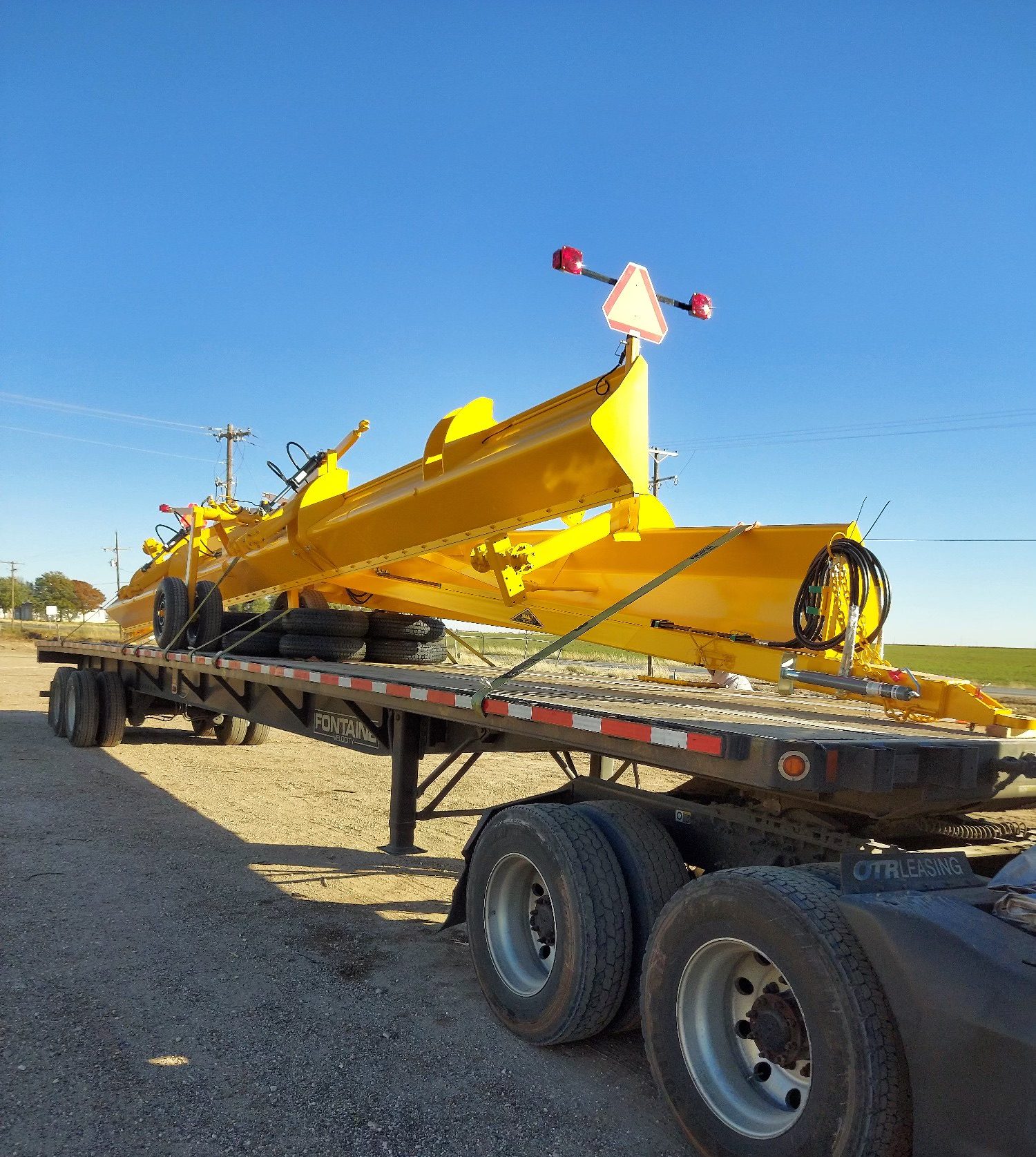 IMG_5091 truck carrying yellow equipment